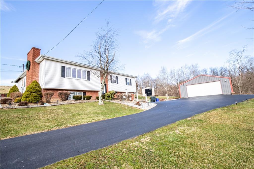 156 Jackson Road New Salem, PA 15468 - Photo 2 of 14 a view of a house with a big yard