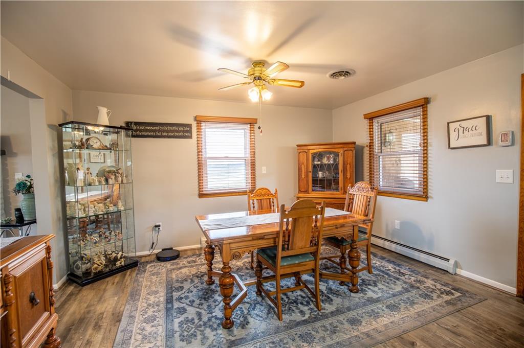 156 Jackson Road New Salem, PA 15468 - Photo 8 of 14 a dining room with wooden floor and a window