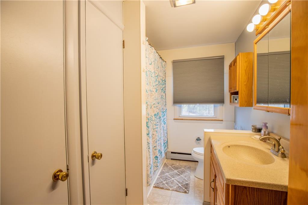 156 Jackson Road New Salem, PA 15468 - Photo 9 of 14 a bathroom with a sink and a mirror