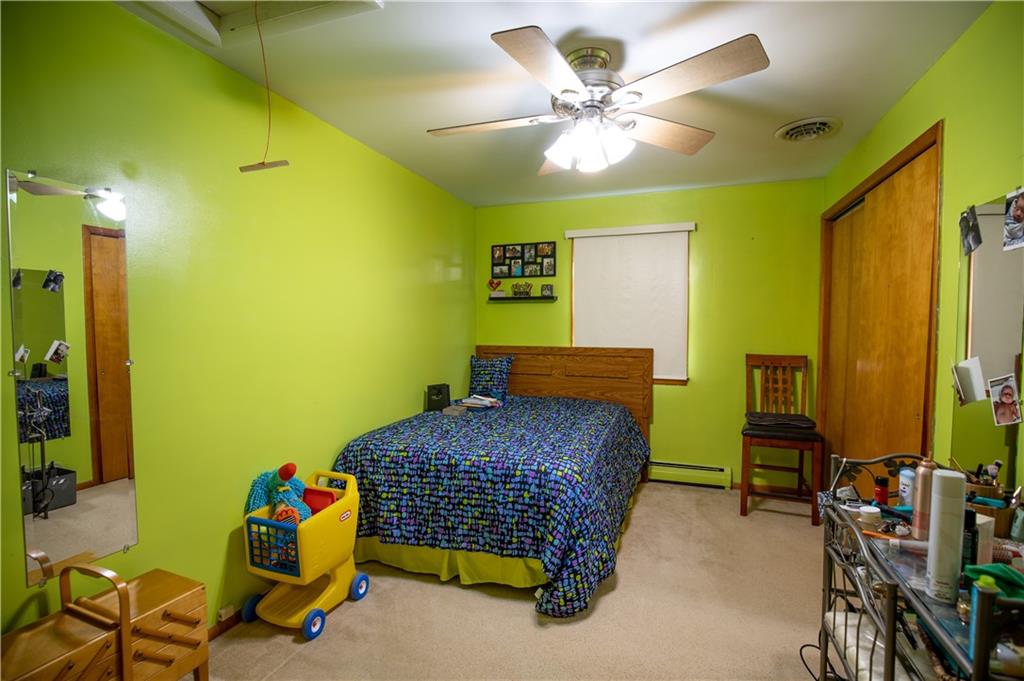 156 Jackson Road New Salem, PA 15468 - Photo 10 of 14 a bedroom with a bed and a chandelier