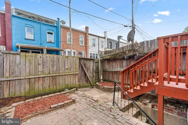 a backyard of a house with seating space