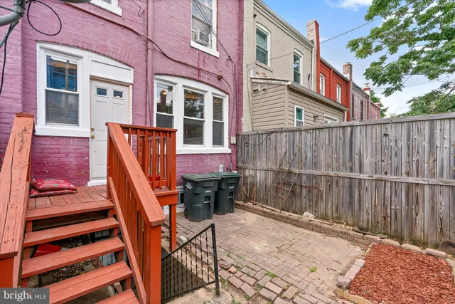 a view of a house with large windows