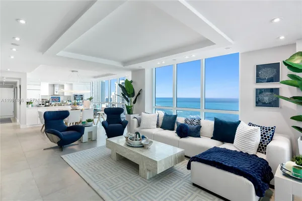 a living room with furniture and a table