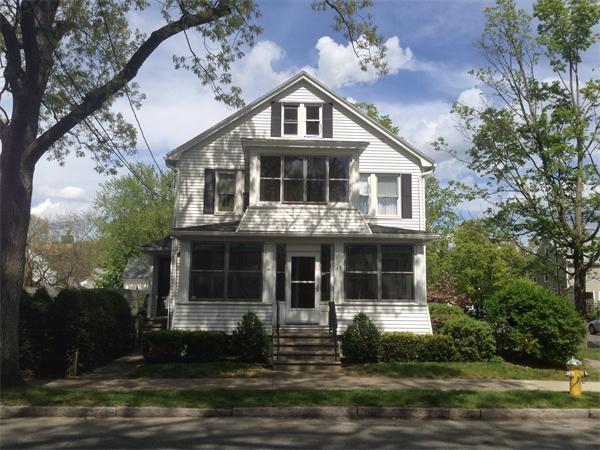 151-153 Draper Street Springfield, MA 01108 - Photo 1 of 13 a front view of a house with a yard