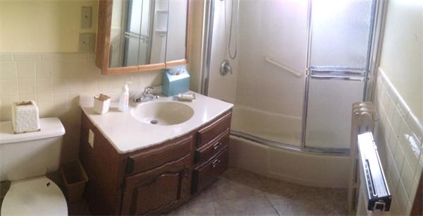151-153 Draper Street Springfield, MA 01108 - Photo 13 of 13 a bathroom with a sink toilet and shower