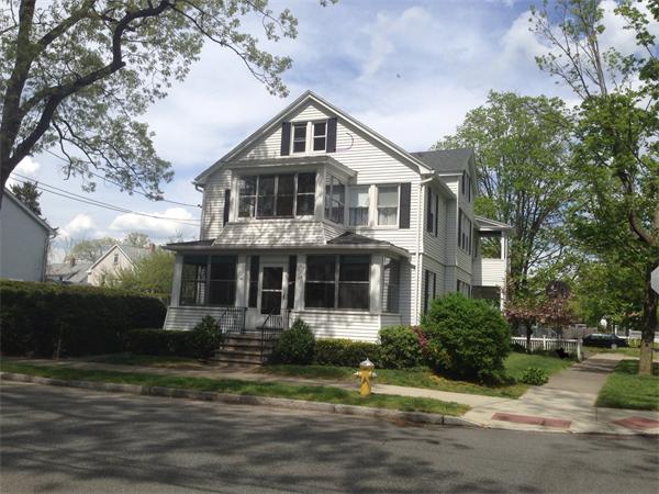 151-153 Draper Street Springfield, MA 01108 - Photo 3 of 13 a front view of a house with a yard
