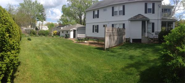 151-153 Draper Street Springfield, MA 01108 - Photo 6 of 13 a view of backyard of house with green space