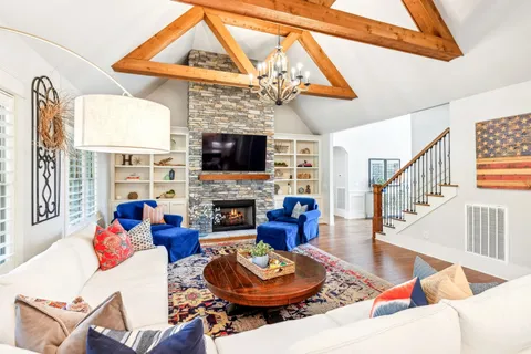 a kitchen with kitchen island granite countertop a sink a center island and stainless steel appliances