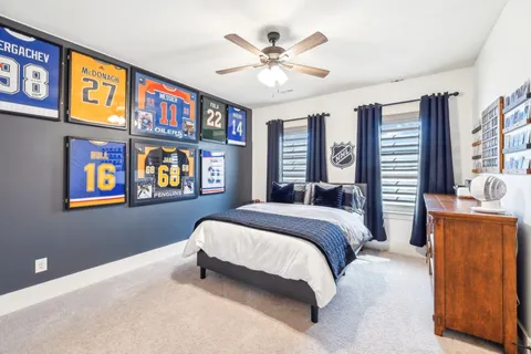 a view of a house with a big yard and potted plants