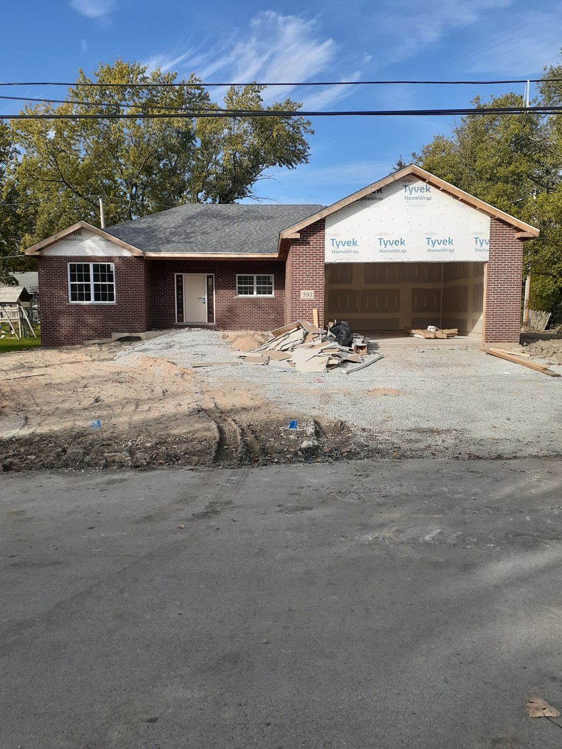 593 Farm Street Crete, IL 60417 - Photo 1 of 28 a front view of a house with a yard