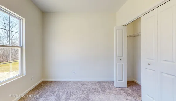 an empty room with a empty space and windows