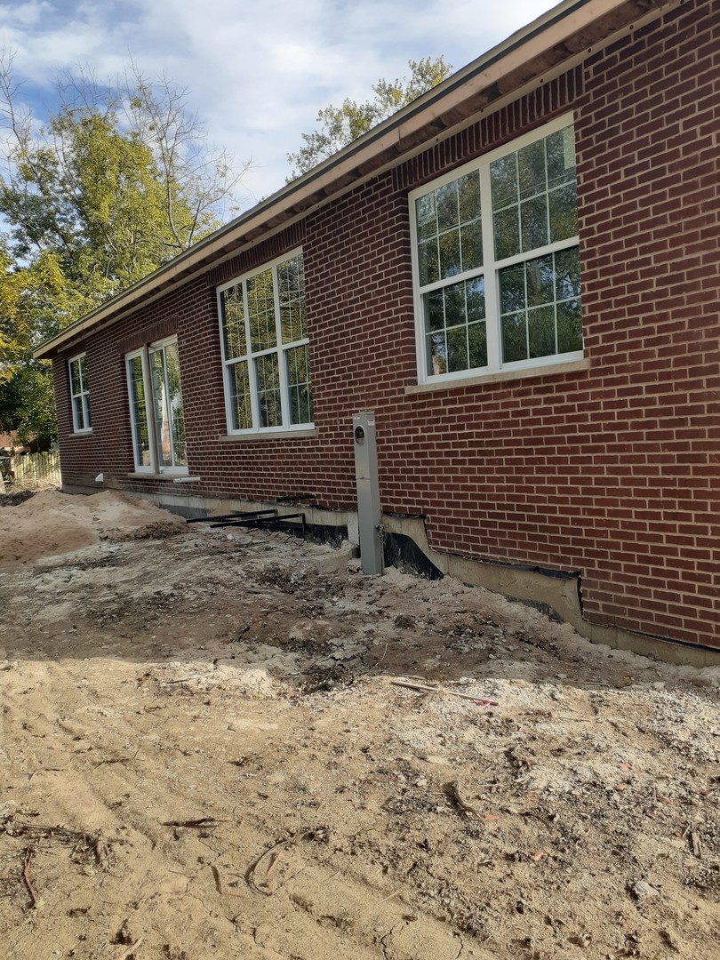 593 Farm Street Crete, IL 60417 - Photo 2 of 28 a front view of a house with a yard