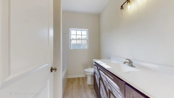 a view of a kitchen from the hallway
