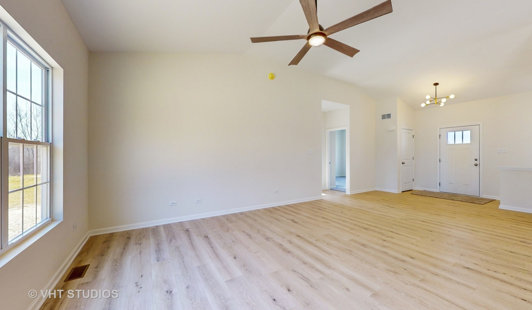 593 Farm Street Crete, IL 60417 - Photo 5 of 28 a view of empty room with wooden floor and fan