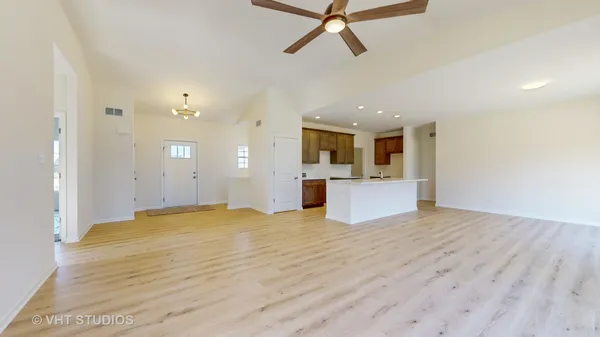 a view of a kitchen with a sink and cabinets