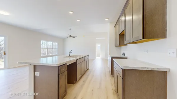 a kitchen with a sink a counter top space and appliances