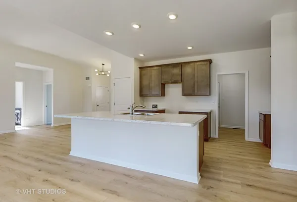 a view of kitchen with stainless steel appliances granite countertop sink