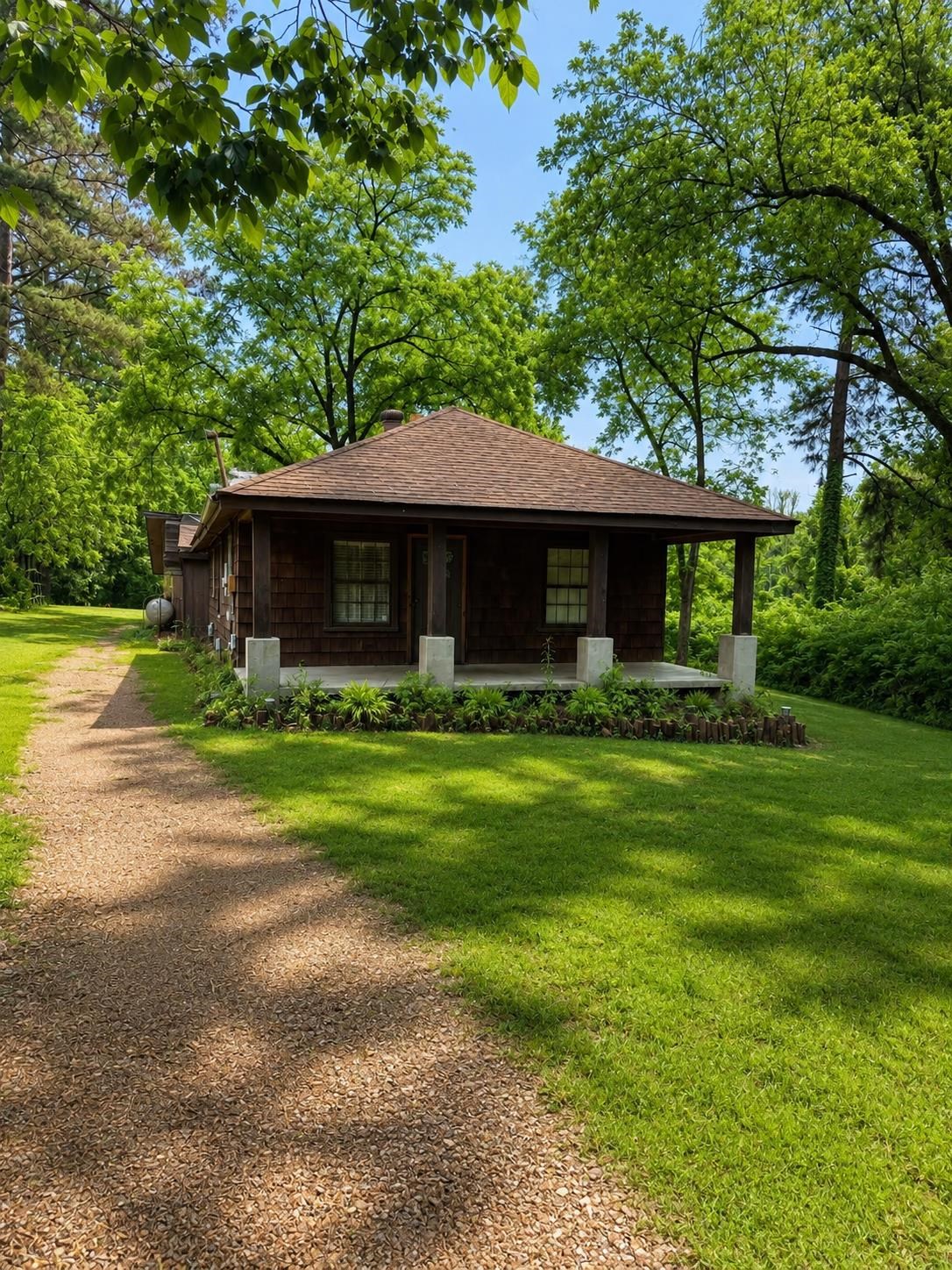 6760 Locke Road Millington, TN 38053 - Photo 1 of 31 a front view of a house with garden
