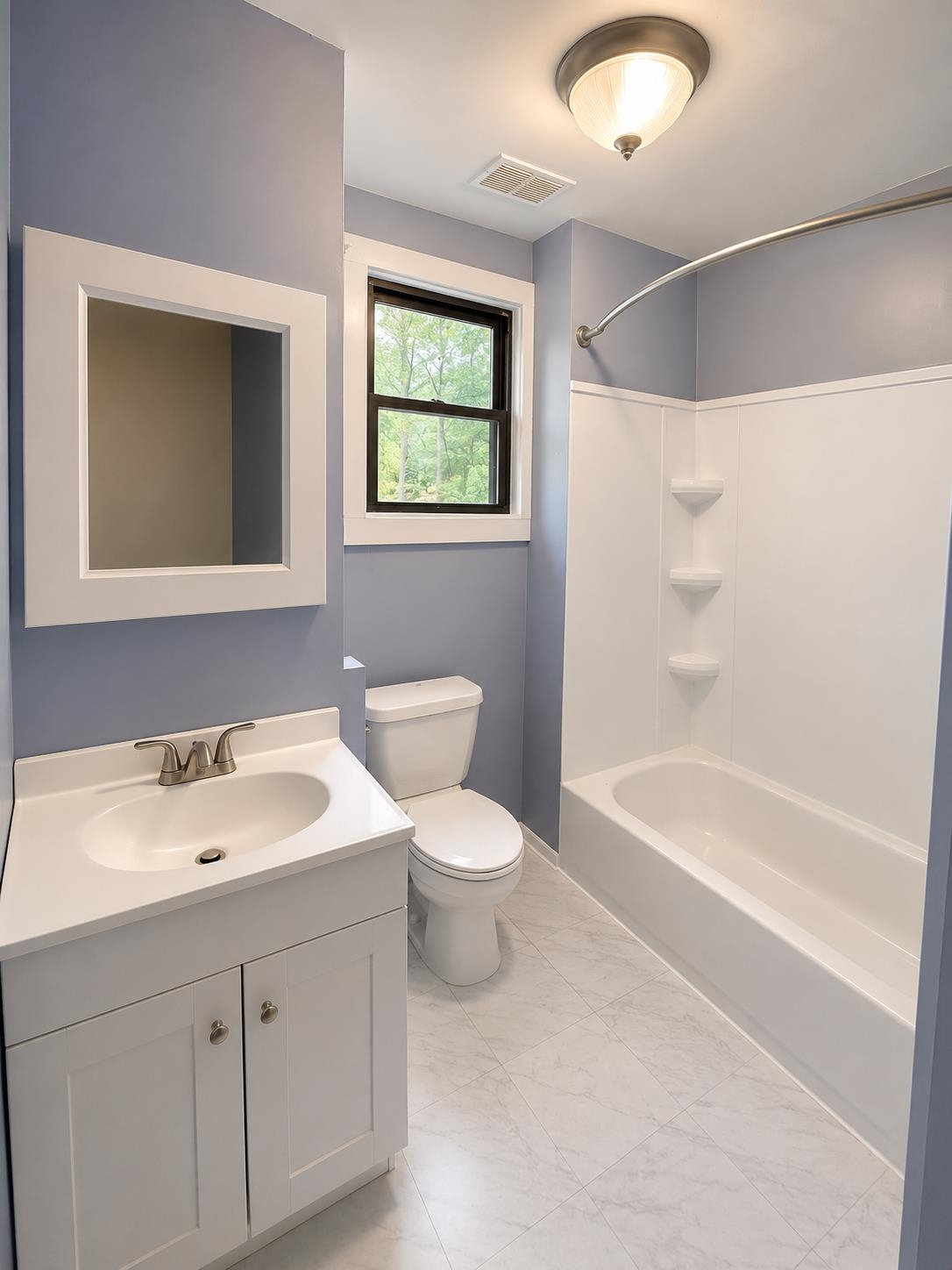 6760 Locke Road Millington, TN 38053 - Photo 18 of 31 a bathroom with a toilet a sink and a bathtub