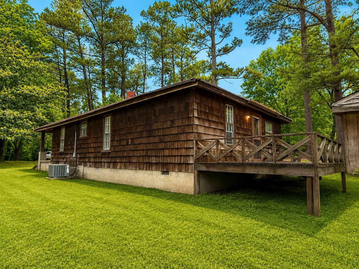6760 Locke Road Millington, TN 38053 - Photo 24 of 31 a backyard of a house with wooden deck and barbeque oven
