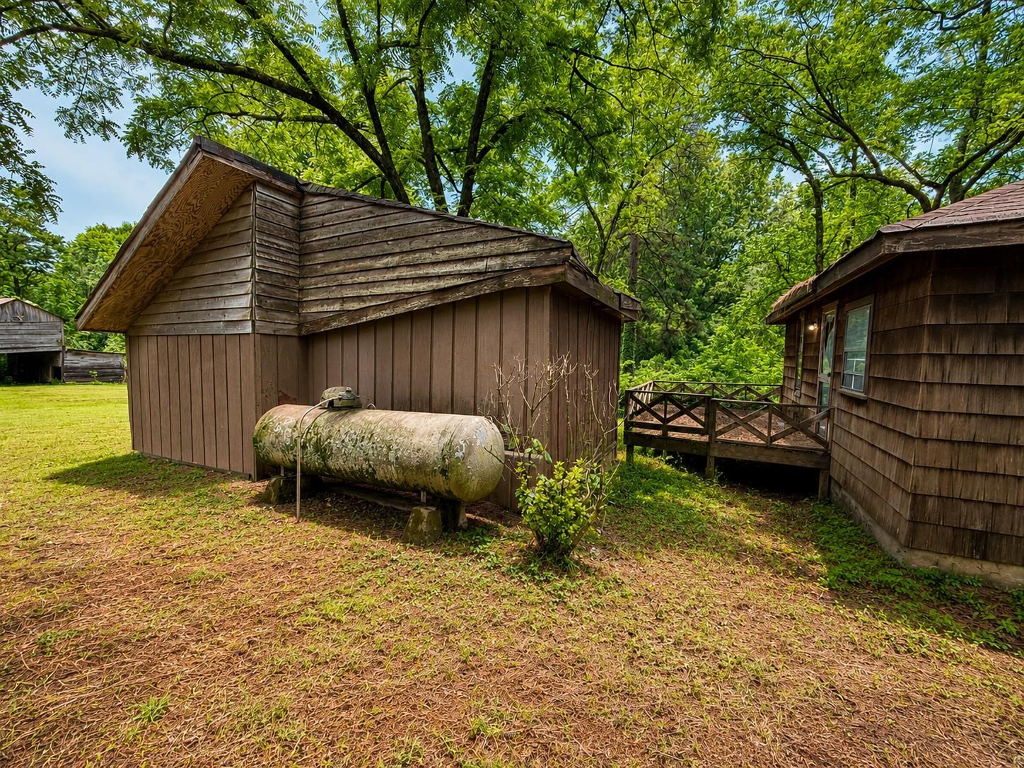 6760 Locke Road Millington, TN 38053 - Photo 30 of 31 a backyard of a house with yard and outdoor seating