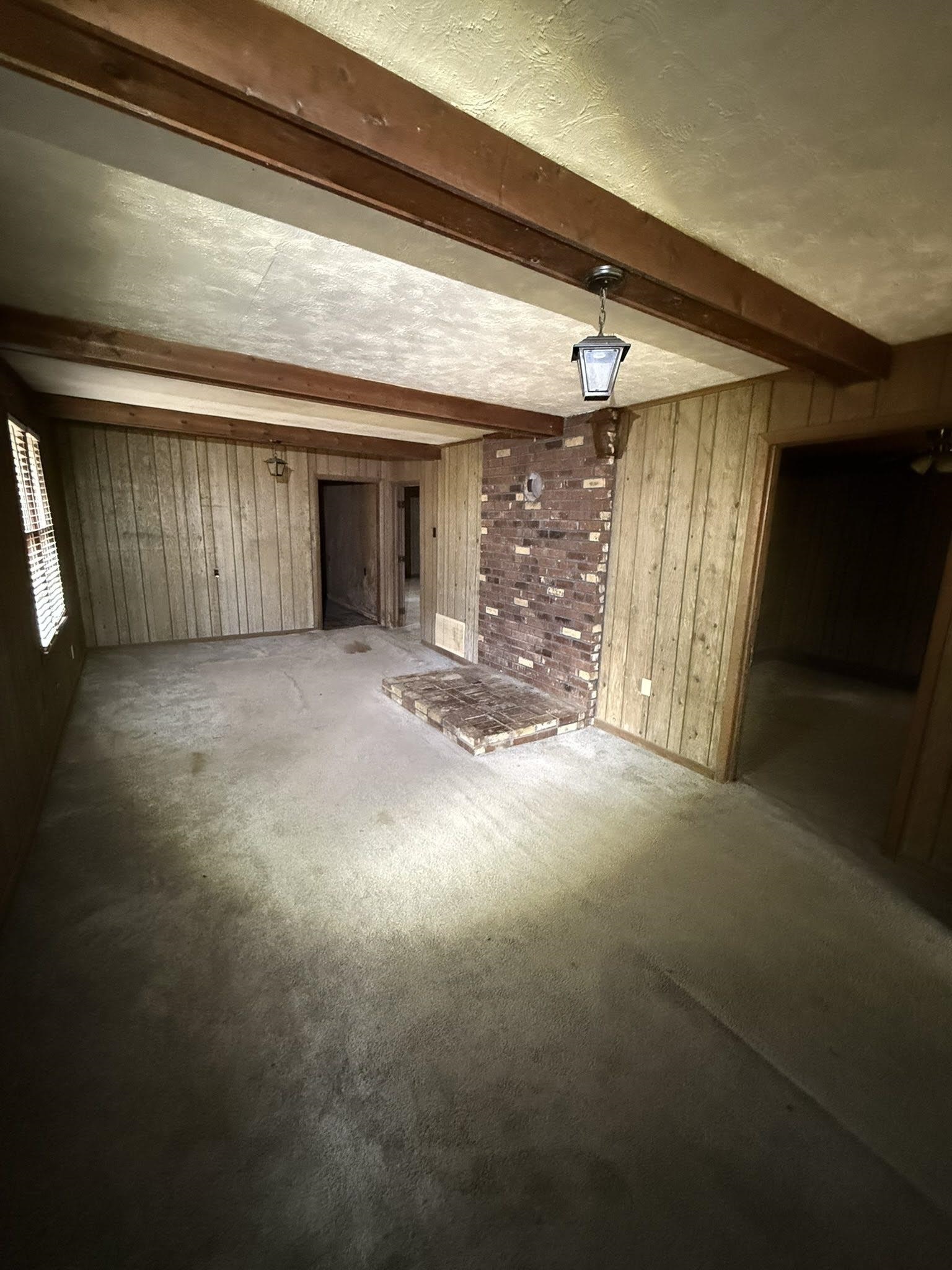 6760 Locke Road Millington, TN 38053 - Photo 3 of 31 a view of a livingroom with an empty space and a window