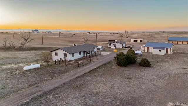 an aerial view of a house with a outdoor space