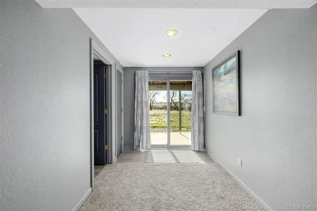 a view of hallway with windows