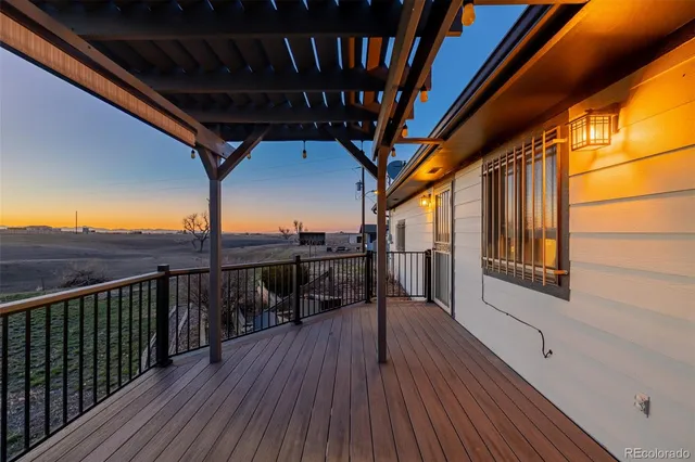 a view of balcony with wooden floor