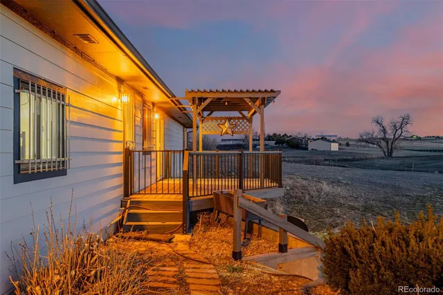a view of a balcony with chairs