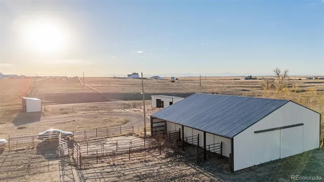 a terrace with a table and chairs