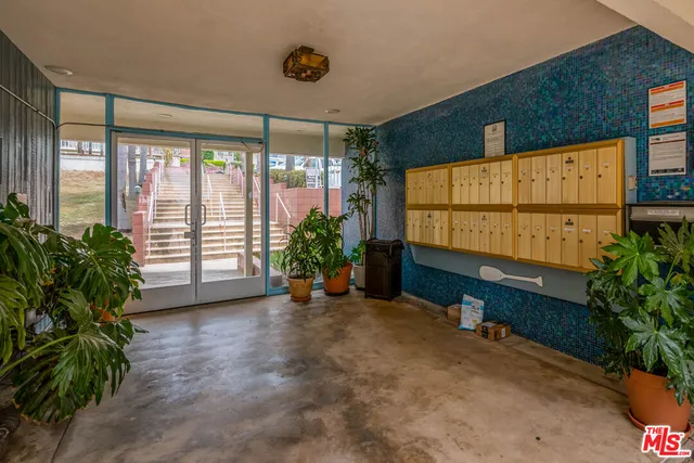 a view of a garden with an outdoor seating