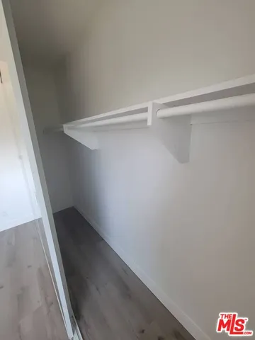 a view of an empty walk in closet
