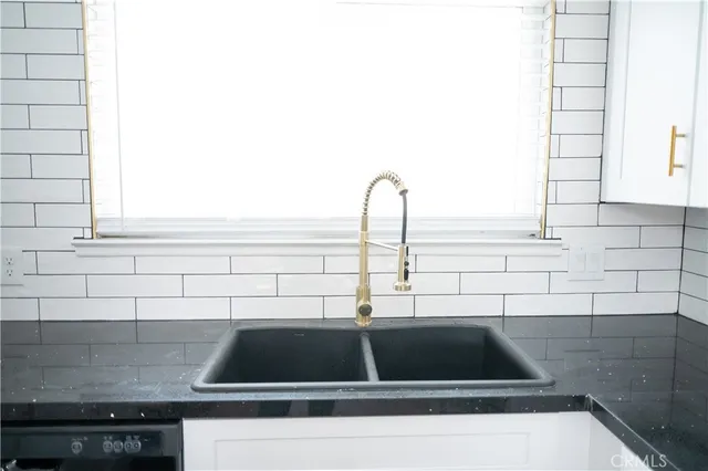 a view of sink and microwave