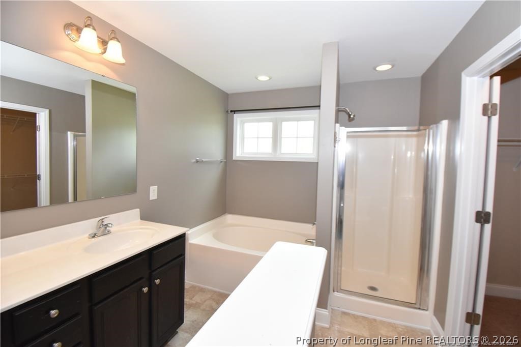131 South Prince Henry Way Cameron, NC 28326 - Photo 12 of 26 a bathroom with a double vanity sink and mirror