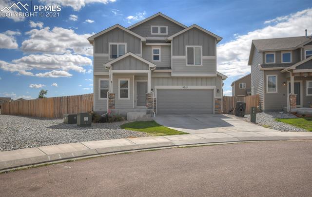 6218 Pilgrimage Road Colorado Springs, CO 80925 - Photo 3 of 42 Home has a large backyard, front porch and Nice exterior colors with stone!