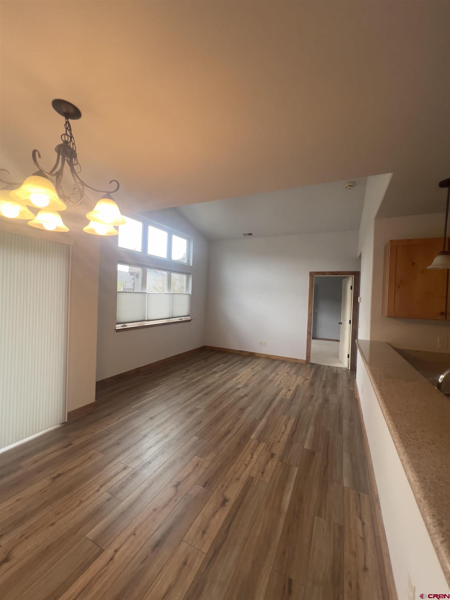 540 Redcliff Circle, Unit E 203 Ridgway, CO 81432 - Photo 13 of 36 a view of empty room with wooden floor and fan