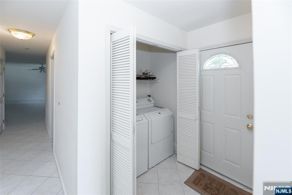 499 Morse Avenue Ridgefield, NJ 07657 - Photo 14 of 45 a bathroom with a sink and a mirror