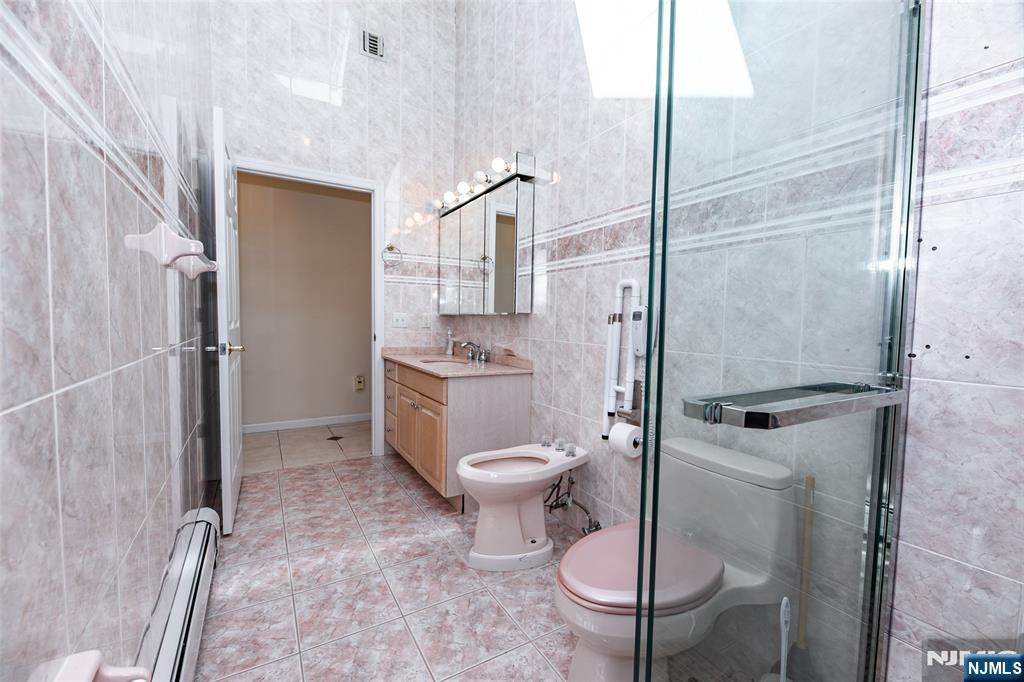 499 Morse Avenue Ridgefield, NJ 07657 - Photo 25 of 45 a bathroom with a toilet and a shower
