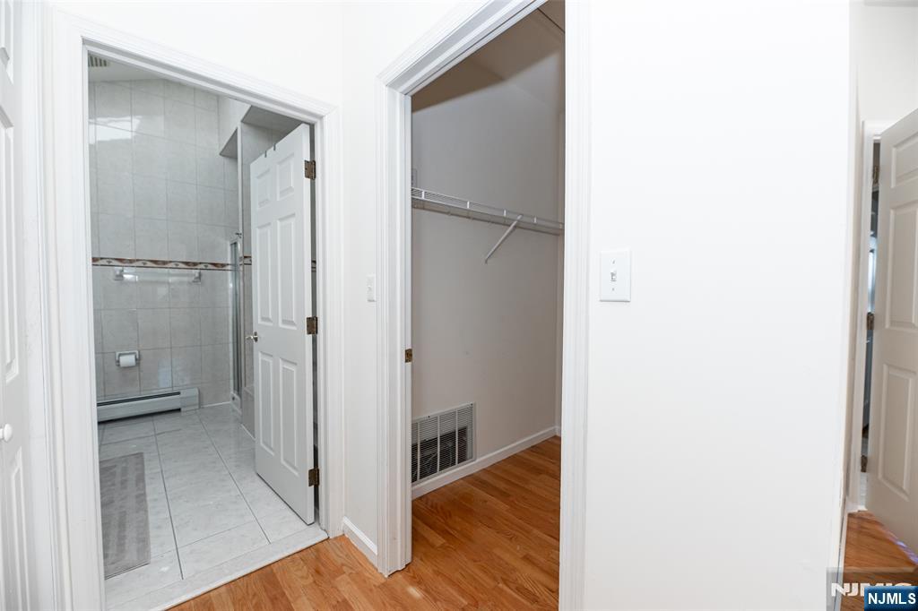 499 Morse Avenue Ridgefield, NJ 07657 - Photo 31 of 45 a view of a room with a hallway and wooden floor