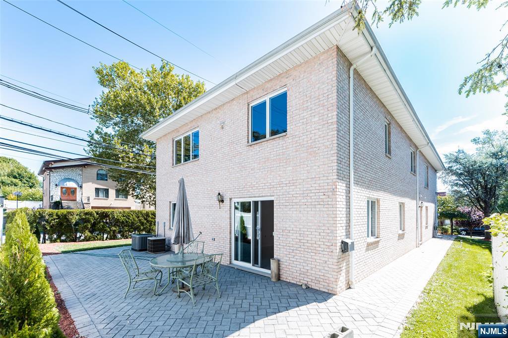 499 Morse Avenue Ridgefield, NJ 07657 - Photo 39 of 45 a view of a house with backyard and sitting area