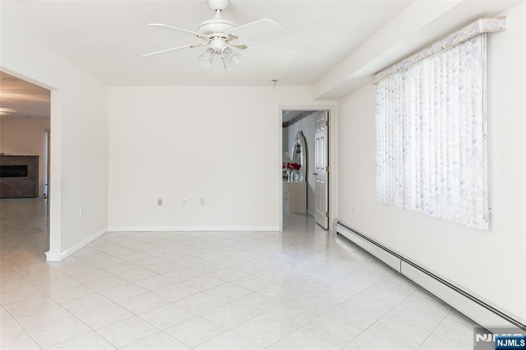 499 Morse Avenue Ridgefield, NJ 07657 - Photo 7 of 45 a view of an empty room with a window