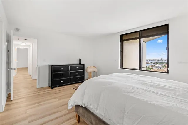 a bed room with a bed and a television