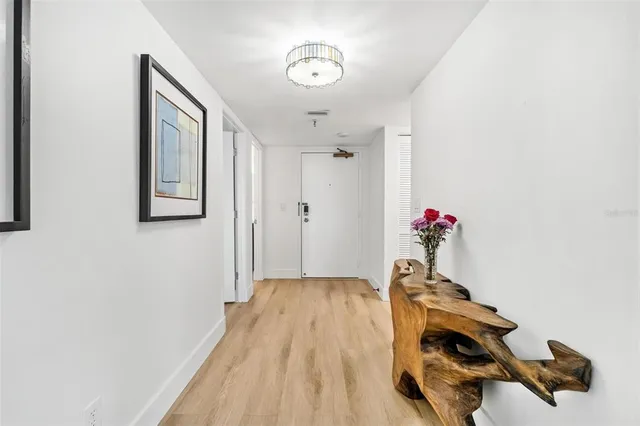 a view of entryway with wooden floor