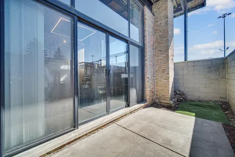 a bathroom with a glass door shower and mirror