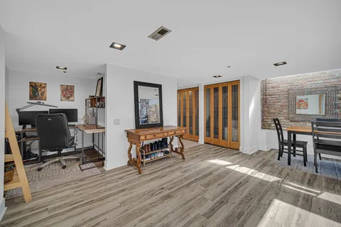 a view of a livingroom with furniture and a window