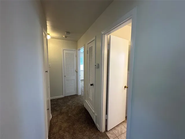 a view of a bathroom from a hallway