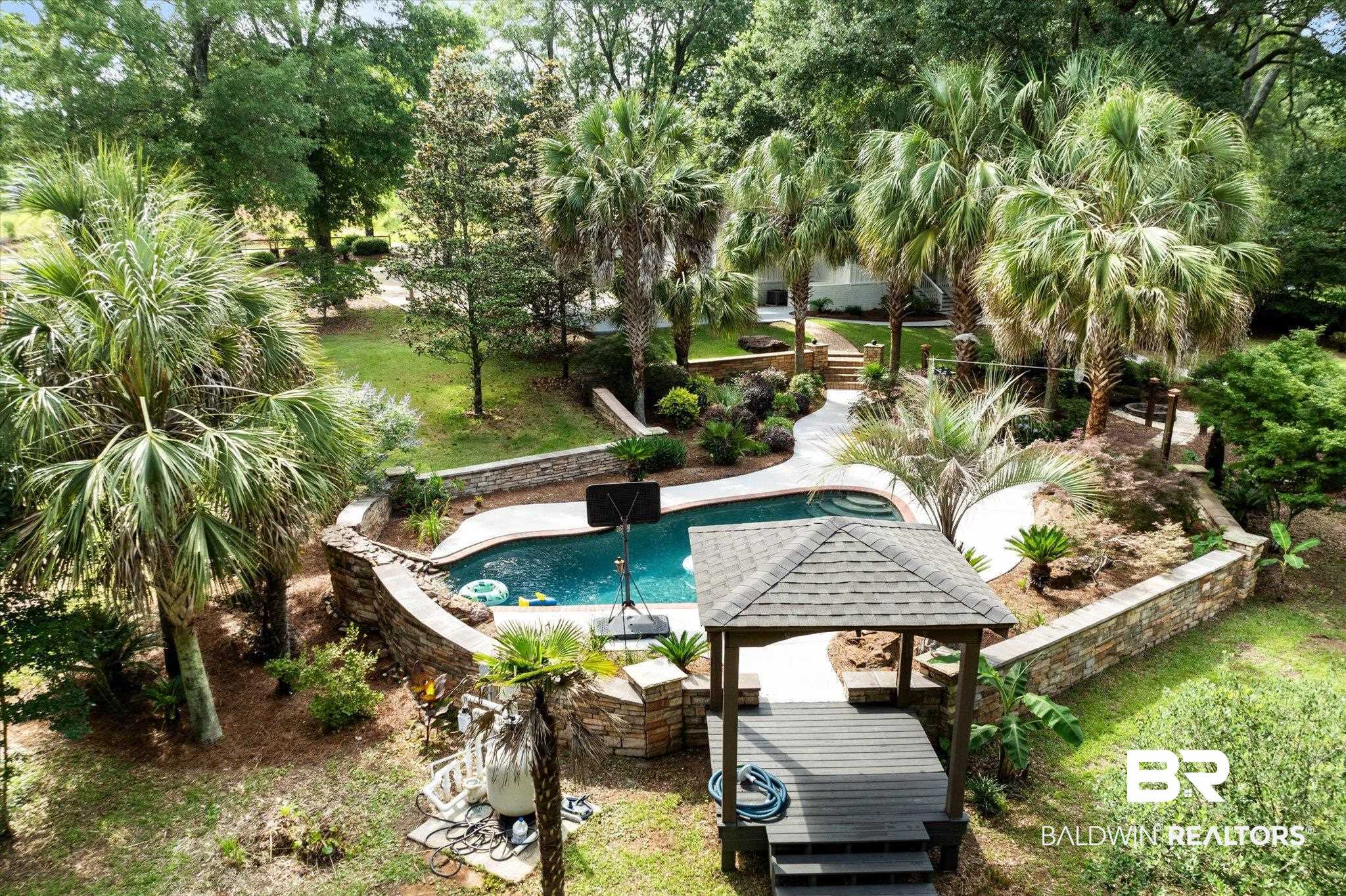 3715 Latigo Road Mobile, AL 36695 - Photo 29 of 39 Outdoor pool with a lawn and view of wooded area
