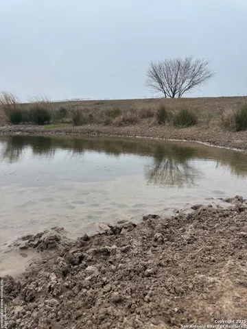 a view of a lake with a yard