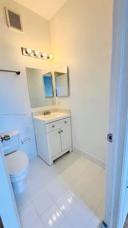 a bathroom with a sink toilet and tub